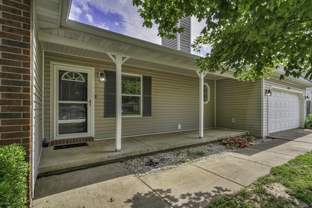 2236 E Logan St, Republic, MO 65738 - doorway to property featuring a porch, a garage, and a chimney