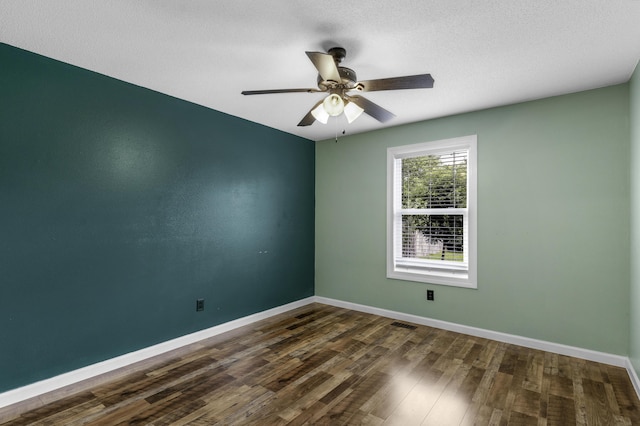 2236 E Logan St, Republic, MO 65738 - spare room featuring baseboards, dark wood-style flooring, and a ceiling fan