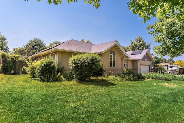 4501 N 16th St, Ozark, MO 65721 - view of home's exterior featuring stucco siding, a garage, and solar panels