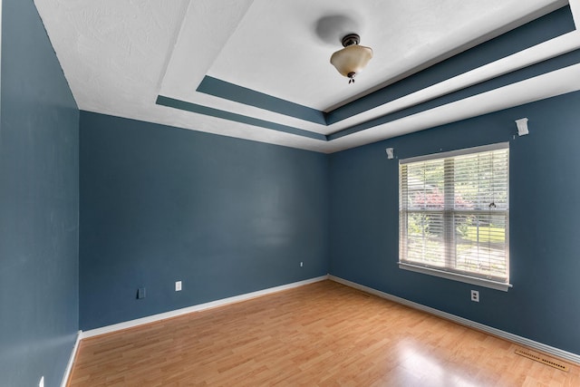 4501 N 16th St, Ozark, MO 65721 - empty room with wood finished floors and a tray ceiling