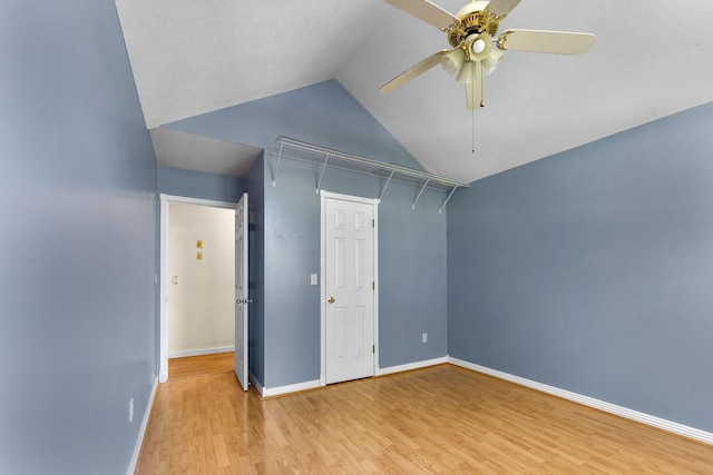 4501 N 16th St, Ozark, MO 65721 - unfurnished bedroom featuring wood finished floors, lofted ceiling, and ceiling fan