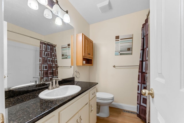 4501 N 16th St, Ozark, MO 65721 - full bath with wood finished floors, vanity, and curtained shower