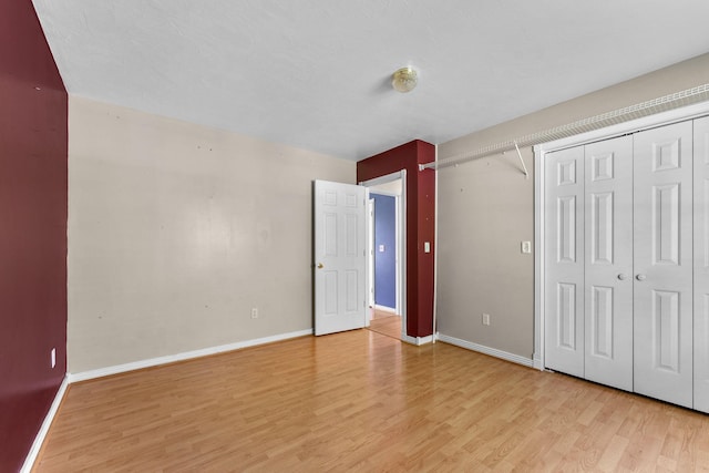 4501 N 16th St, Ozark, MO 65721 - unfurnished bedroom with light wood-style flooring