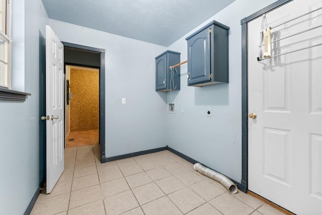 4501 N 16th St, Ozark, MO 65721 - laundry area featuring electric dryer hookup, hookup for a washing machine, cabinet space, and light tile patterned flooring