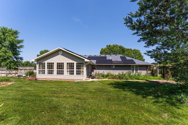 4501 N 16th St, Ozark, MO 65721 - back of property featuring solar panels and a sunroom