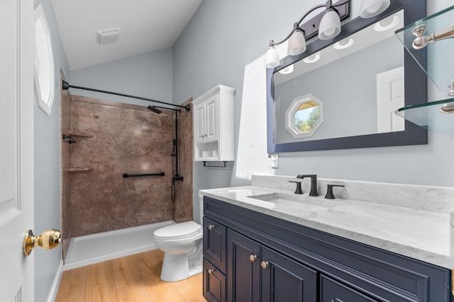 4501 N 16th St, Ozark, MO 65721 - bathroom with vanity, walk in shower, vaulted ceiling, and wood finished floors