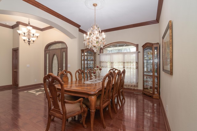 117 Hidden Shores Dr, Branson West, MO 65737 - dining space featuring a chandelier, arched walkways, wood finished floors, baseboards, and crown molding