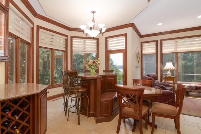 117 Hidden Shores Dr, Branson West, MO 65737 - dining space featuring light tile patterned flooring, plenty of natural light, a chandelier, and crown molding