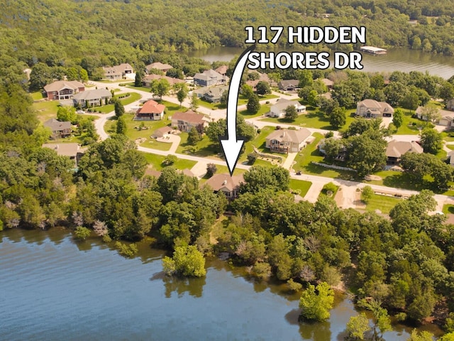 117 Hidden Shores Dr, Branson West, MO 65737 - aerial perspective of suburban area with a heavily wooded area and a nearby body of water