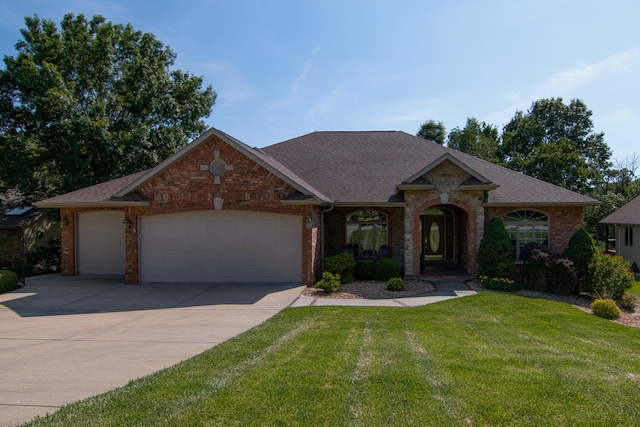 117 Hidden Shores Dr, Branson West, MO 65737 - view of front facade featuring a garage, driveway, a front lawn, and a shingled roof