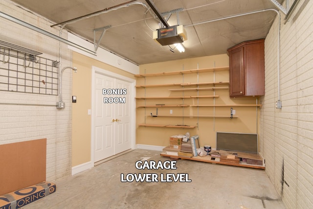 117 Hidden Shores Dr, Branson West, MO 65737 - garage with a garage door opener and baseboards