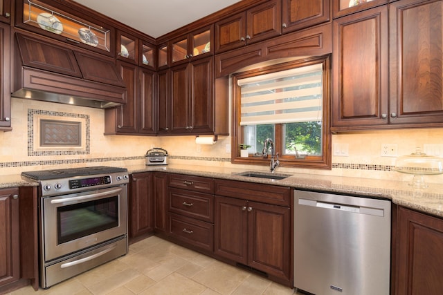 117 Hidden Shores Dr, Branson West, MO 65737 - kitchen featuring stainless steel appliances, a sink, backsplash, and light tile patterned flooring