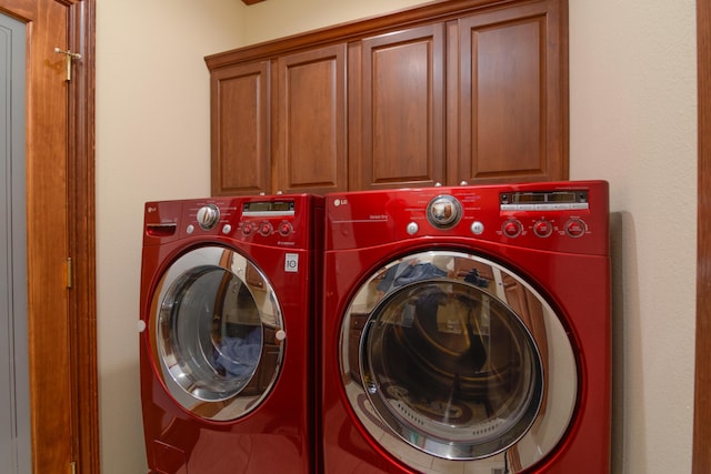 117 Hidden Shores Dr, Branson West, MO 65737 - washroom with cabinet space and washing machine and dryer