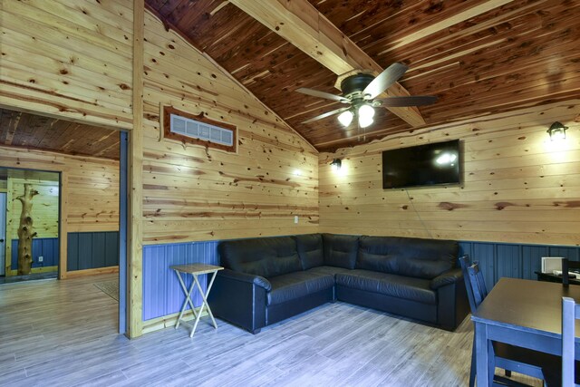145 Allison Bnd, Lampe, MO 65681 - unfurnished living room featuring wood walls, wooden ceiling, a ceiling fan, and wood finished floors