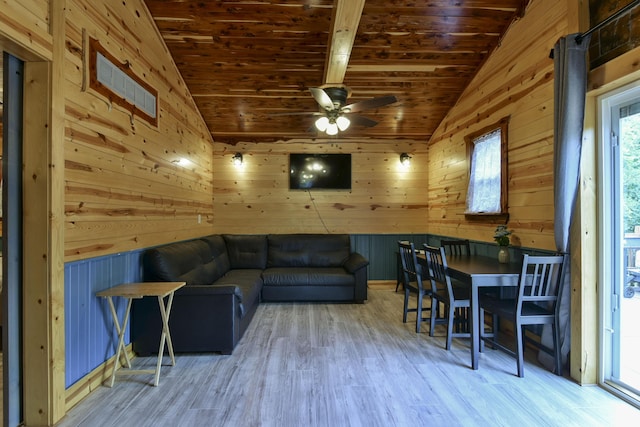 145 Allison Bnd, Lampe, MO 65681 - living area with vaulted ceiling, a ceiling fan, wood finished floors, wood walls, and wooden ceiling