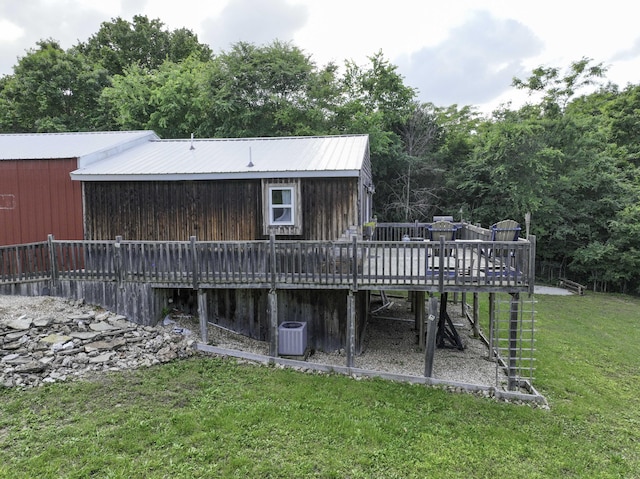 145 Allison Bnd, Lampe, MO 65681 - rear view of house with a deck, a lawn, metal roof, and central AC