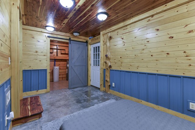 145 Allison Bnd, Lampe, MO 65681 - unfurnished bedroom with a barn door, wooden walls, wooden ceiling, and water heater