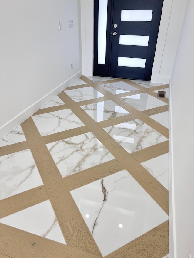 2090 N Silver Charm Ave, Springfield, MO 65802 - foyer featuring inlaid floor details, marble tiled flooring, and baseboards