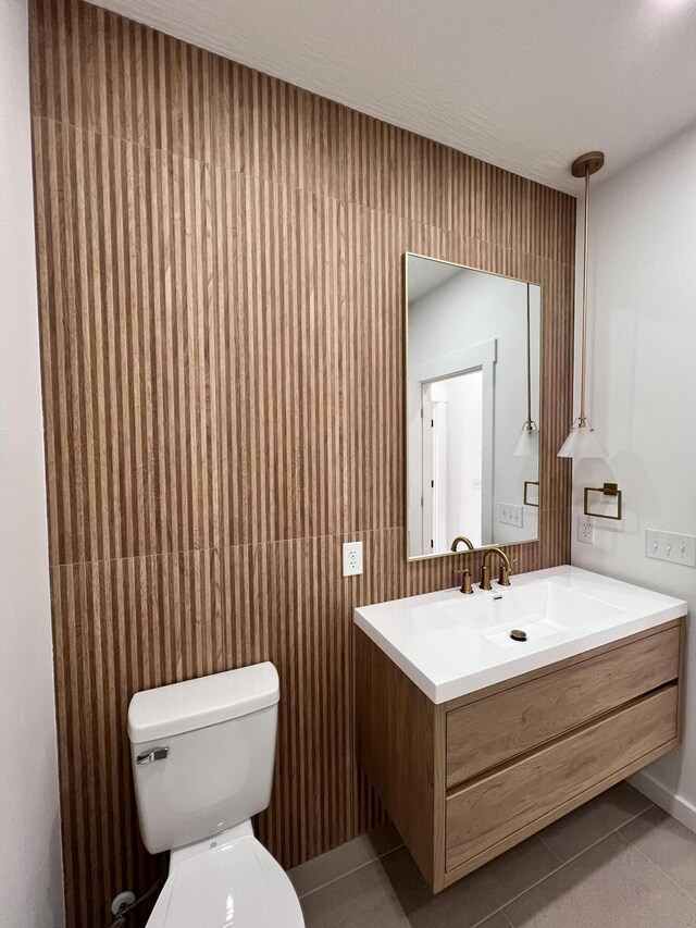 2090 N Silver Charm Ave, Springfield, MO 65802 - half bathroom featuring tile patterned floors, toilet, and vanity