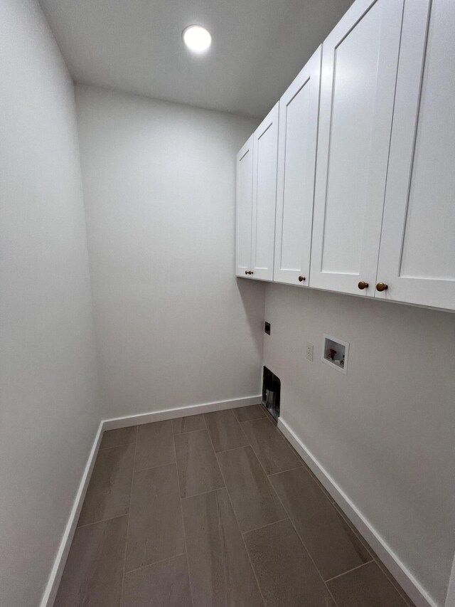 2090 N Silver Charm Ave, Springfield, MO 65802 - laundry room with cabinet space, electric dryer hookup, washer hookup, baseboards, and recessed lighting