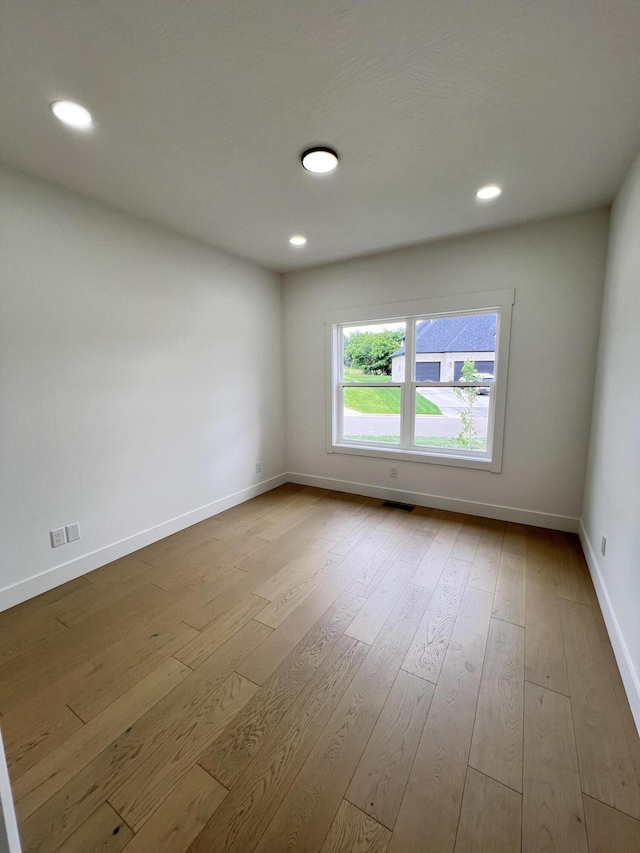 2090 N Silver Charm Ave, Springfield, MO 65802 - empty room featuring wood finished floors, baseboards, and recessed lighting