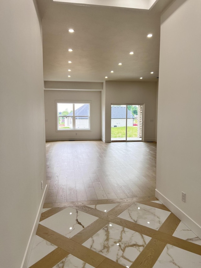 2090 N Silver Charm Ave, Springfield, MO 65802 - empty room featuring recessed lighting, baseboards, plenty of natural light, inlaid floor details, and marble finish flooring