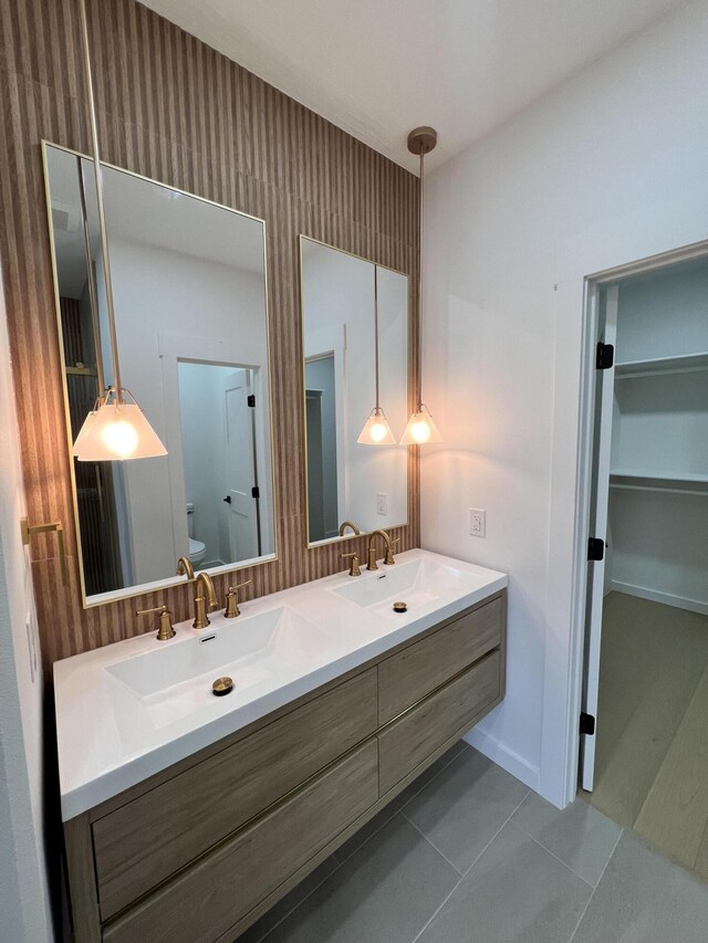 2090 N Silver Charm Ave, Springfield, MO 65802 - full bathroom featuring toilet, double vanity, and tile patterned flooring