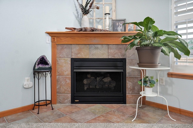 920 Bradford Ct, Marshfield, MO 65706 - detailed view of baseboards and a tile fireplace