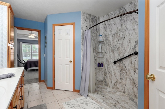 920 Bradford Ct, Marshfield, MO 65706 - full bath featuring a marble finish shower, vanity, connected bathroom, tile patterned flooring, and ceiling fan