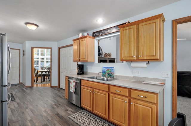 920 Bradford Ct, Marshfield, MO 65706 - kitchen with appliances with stainless steel finishes, a sink, light countertops, dark wood finished floors, and baseboards