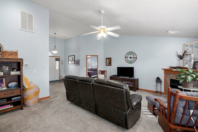 920 Bradford Ct, Marshfield, MO 65706 - living room with carpet, ceiling fan, baseboards, a tile fireplace, and high vaulted ceiling
