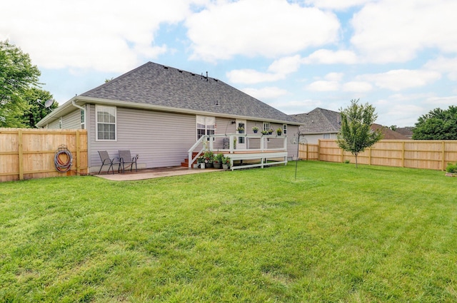 920 Bradford Ct, Marshfield, MO 65706 - back of property featuring a wooden deck, a shingled roof, and a patio