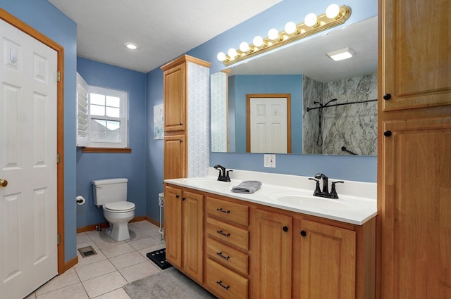 920 Bradford Ct, Marshfield, MO 65706 - bathroom featuring double vanity, tile patterned flooring, a shower, toilet, and baseboards