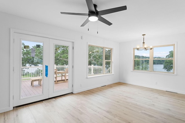 26237 Twin Rivers Dr, Shell Knob, MO 65747 - unfurnished room featuring a chandelier, light wood-type flooring, ceiling fan, and baseboards