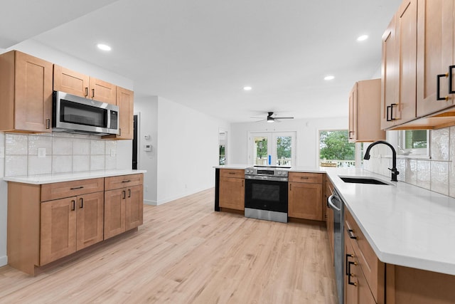 26237 Twin Rivers Dr, Shell Knob, MO 65747 - kitchen featuring stainless steel appliances, a sink, light wood-type flooring, a peninsula, and recessed lighting