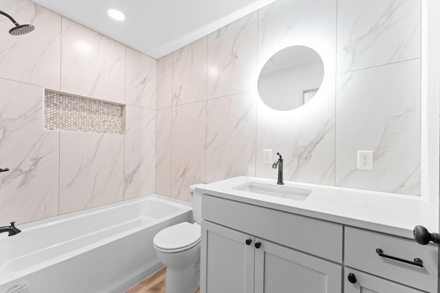 26237 Twin Rivers Dr, Shell Knob, MO 65747 - bathroom featuring vanity, washtub / shower combination, toilet, tile walls, and wood finished floors