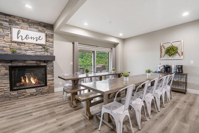 400 Lake Front Dr, Branson, MO 65616 - dining area featuring light wood-style flooring, a stone fireplace, baseboards, and recessed lighting