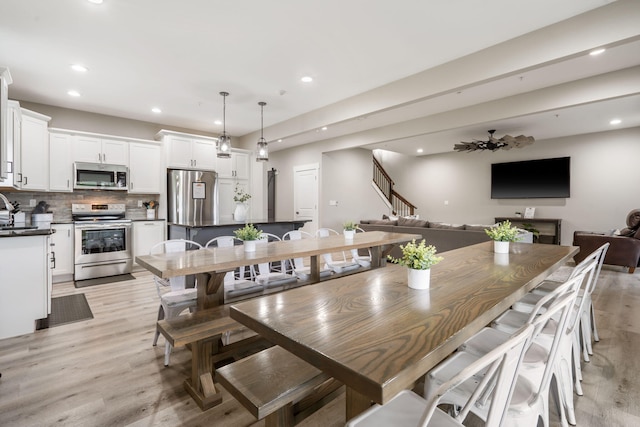 400 Lake Front Dr, Branson, MO 65616 - dining room featuring recessed lighting, light wood finished floors, and stairway