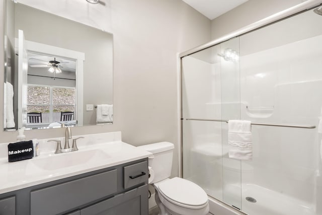 400 Lake Front Dr, Branson, MO 65616 - bathroom featuring ceiling fan, a stall shower, toilet, and vanity