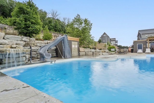 400 Lake Front Dr, Branson, MO 65616 - view of swimming pool featuring a water slide and a patio