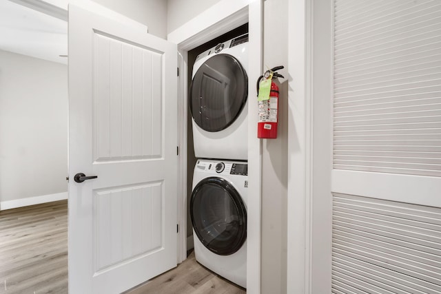 400 Lake Front Dr, Branson, MO 65616 - laundry area with stacked washing machine and dryer and light wood-style floors