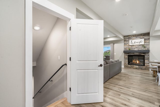 400 Lake Front Dr, Branson, MO 65616 - staircase with wood finished floors, a stone fireplace, baseboards, and recessed lighting
