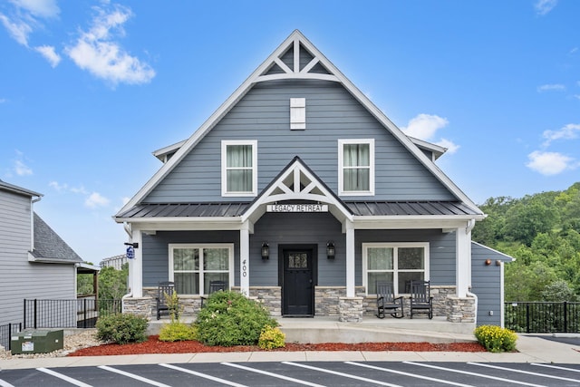 400 Lake Front Dr, Branson, MO 65616 - craftsman house with a porch, uncovered parking, stone siding, and metal roof