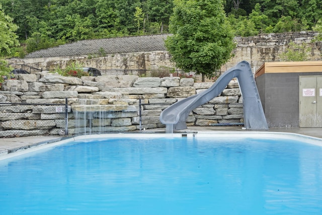 400 Lake Front Dr, Branson, MO 65616 - view of pool with a water slide, a view of trees, and a sink