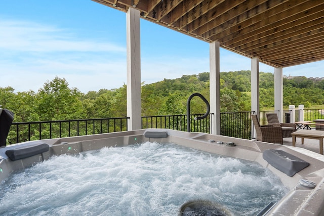 400 Lake Front Dr, Branson, MO 65616 - view of patio / terrace with a hot tub and a wooded view