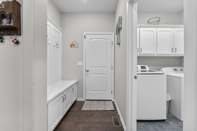 419 Wyldewood Dr, Fordland, MO 65652 - laundry room with cabinet space, washing machine and clothes dryer, dark wood finished floors, and baseboards