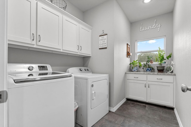 419 Wyldewood Dr, Fordland, MO 65652 - laundry room with separate washer and dryer, baseboards, cabinet space, and dark stone finish flooring