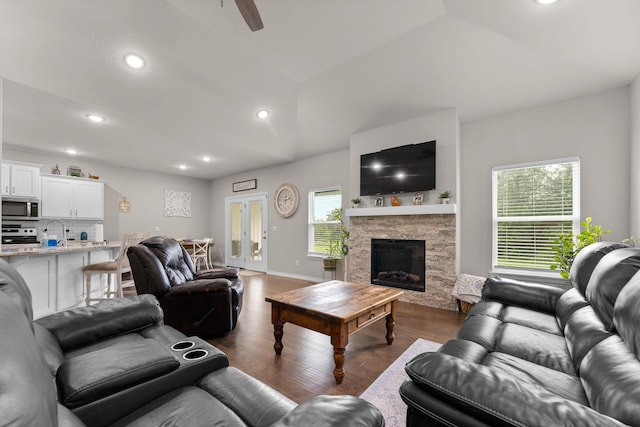 419 Wyldewood Dr, Fordland, MO 65652 - living room with dark wood-type flooring, a stone fireplace, vaulted ceiling, ceiling fan, and recessed lighting