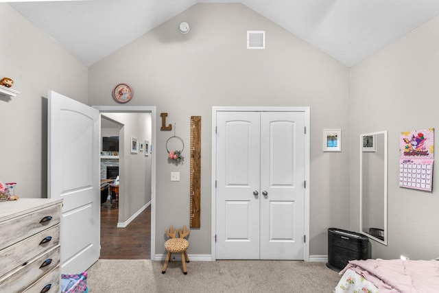 419 Wyldewood Dr, Fordland, MO 65652 - bedroom featuring high vaulted ceiling, light colored carpet, a closet, a stone fireplace, and baseboards