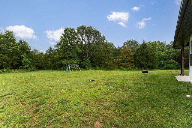 419 Wyldewood Dr, Fordland, MO 65652 - view of green lawn featuring a playground